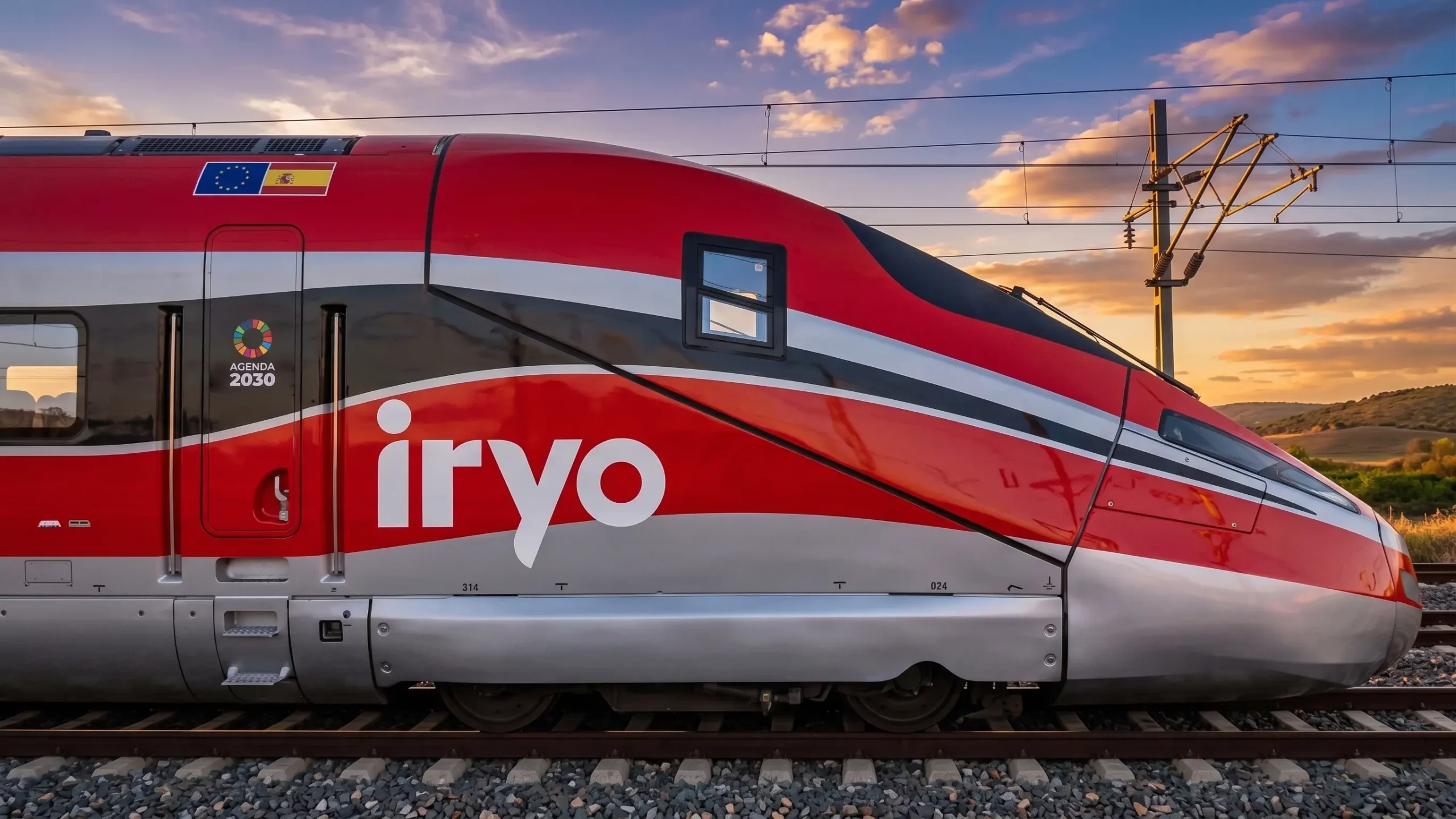 iryo train passing by in the evening